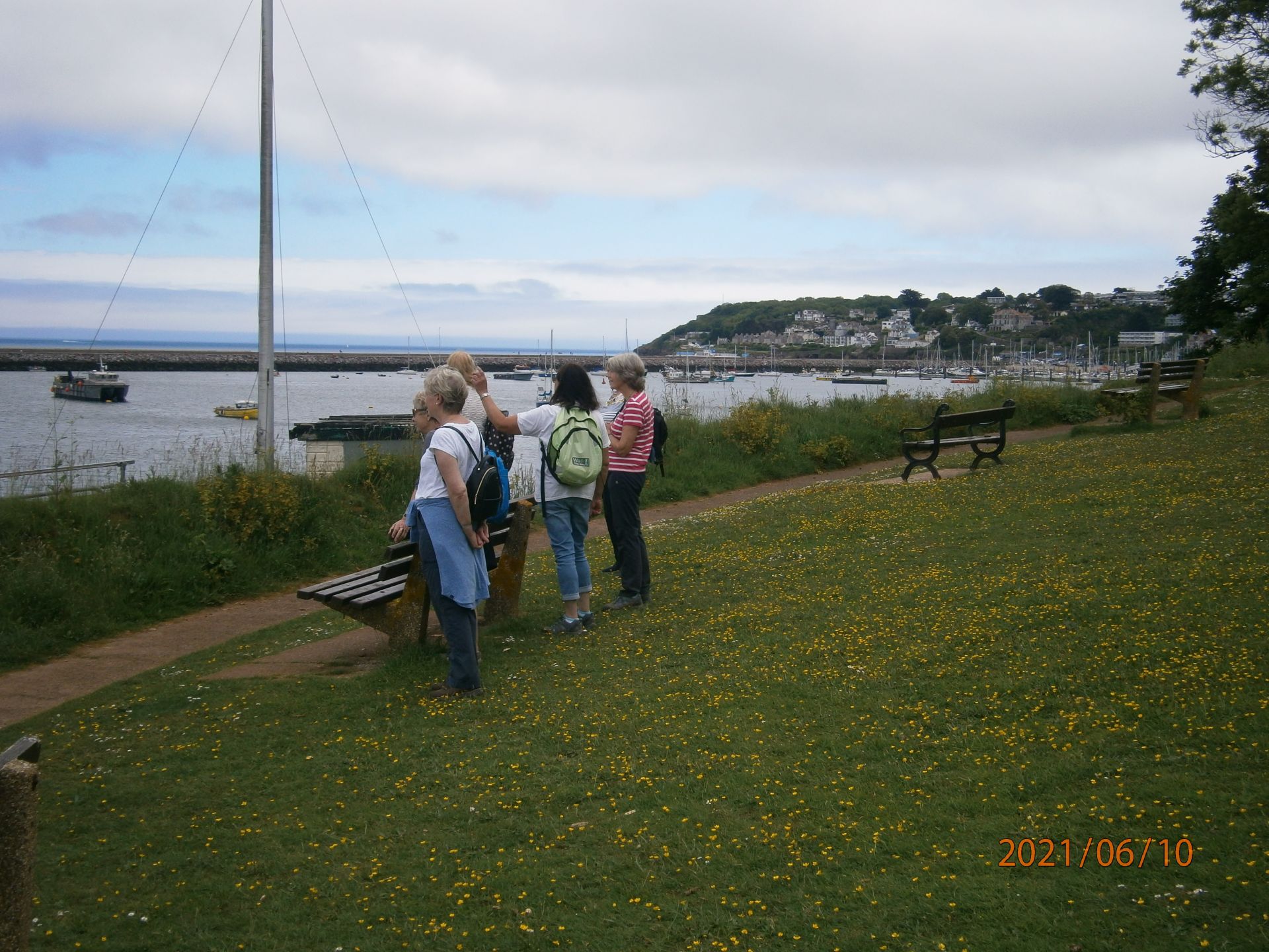 A photo of people walking along a scenic outdoor path